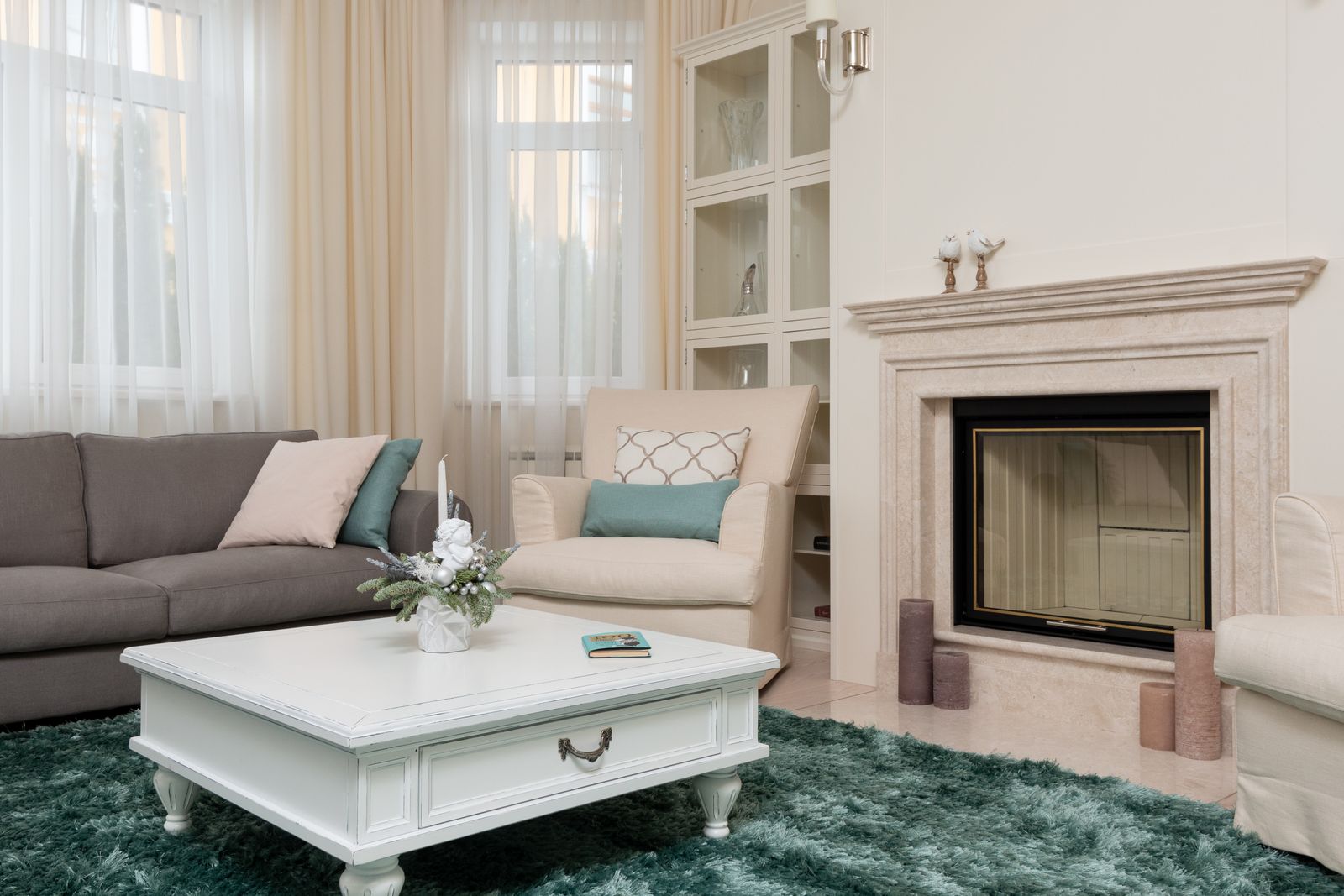 A tidy, sunlit living room with clean carpet and a fireplace — illustrative stock photo, not a photo of a 1st Choice Steam Cleaning job.