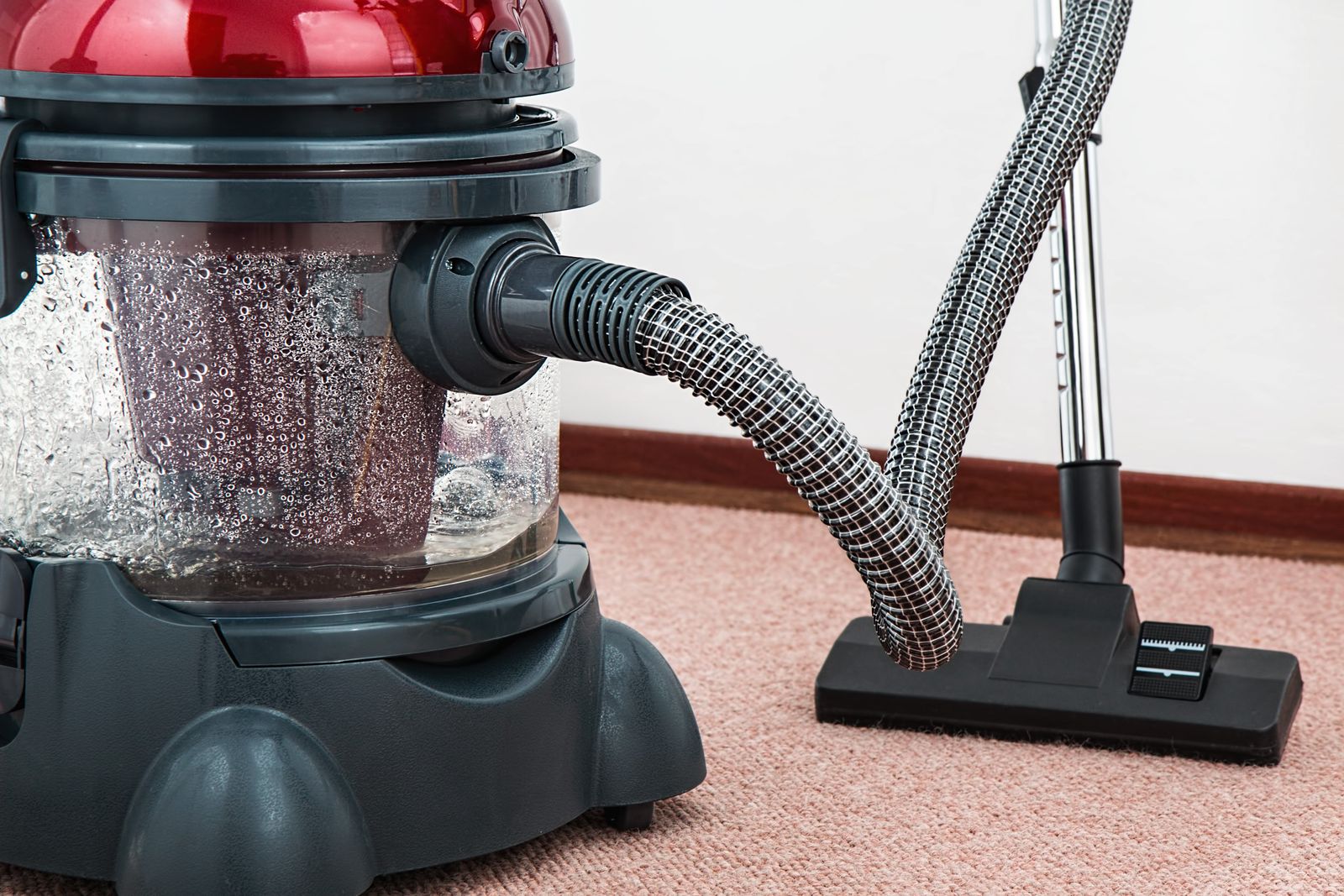Close-up of a water-filtration cleaning machine on a carpeted floor — illustrative stock photo, not 1st Choice's own equipment.
