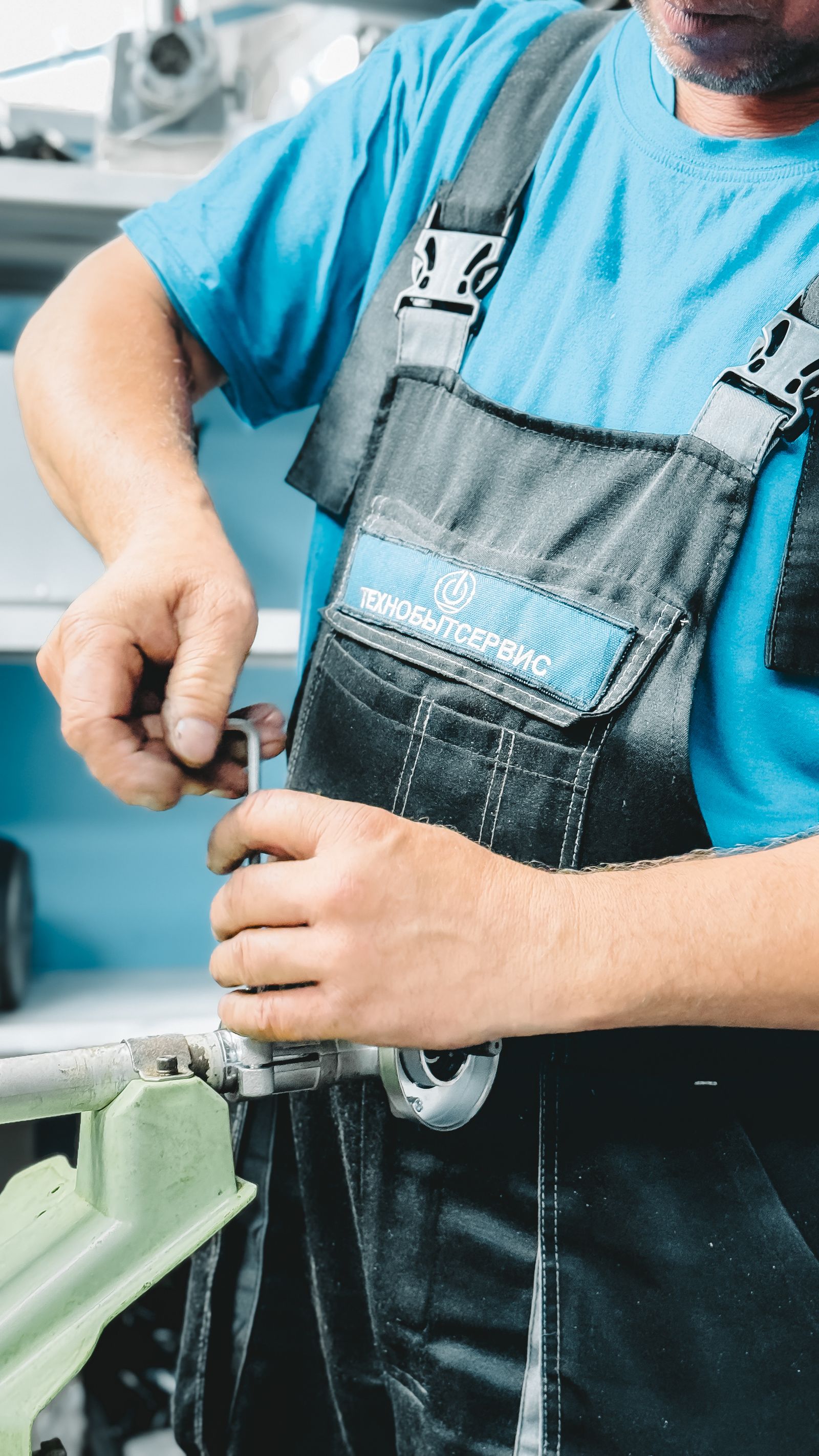 Illustrative close-up stock photo of a plumber repairing a pipe with a wrench — not A G Plumbing's own crew.