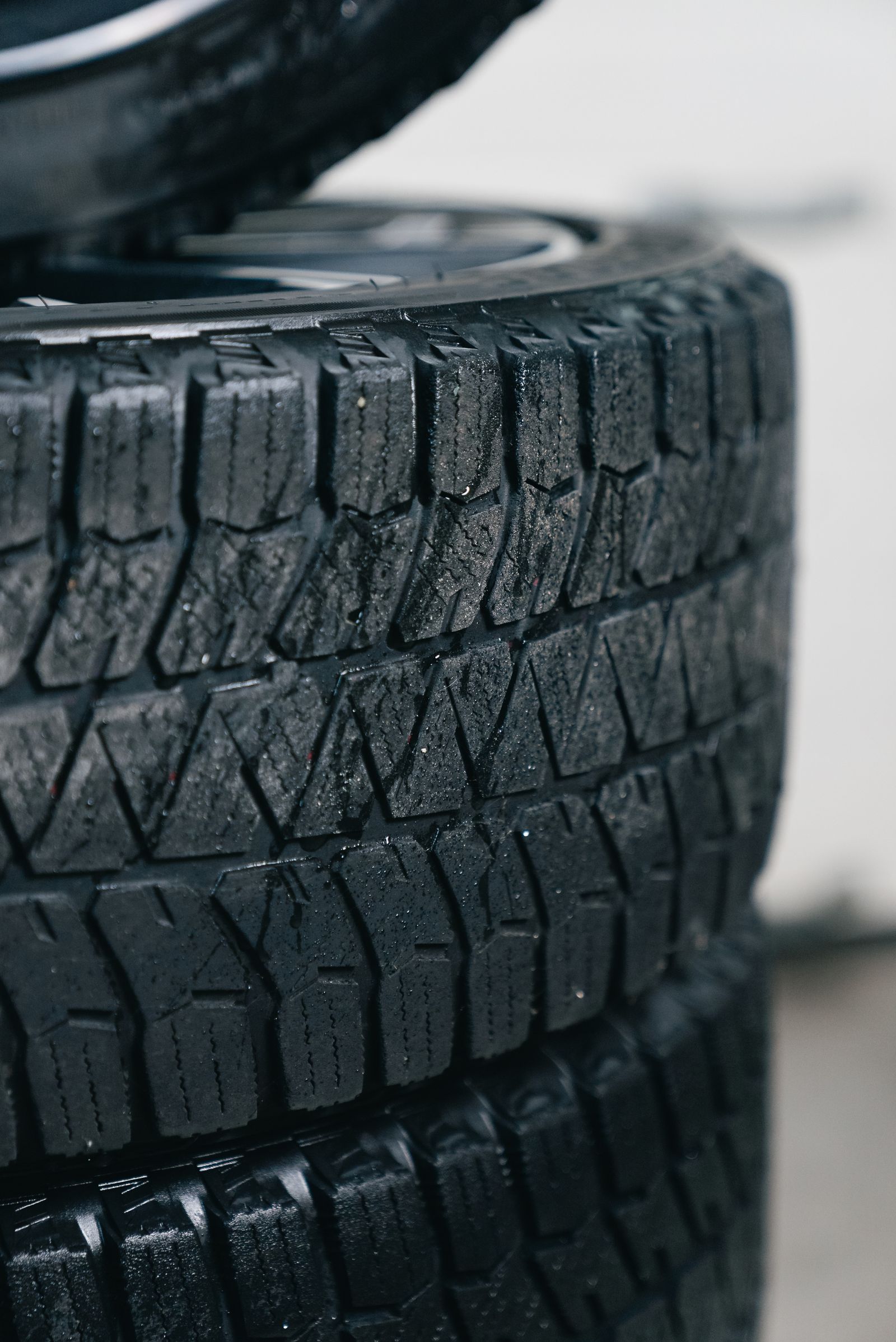 Close-up of stacked car tires showing tread patterns — illustrative stock photo, not a photo of A&L Tire Shop's actual inventory.
