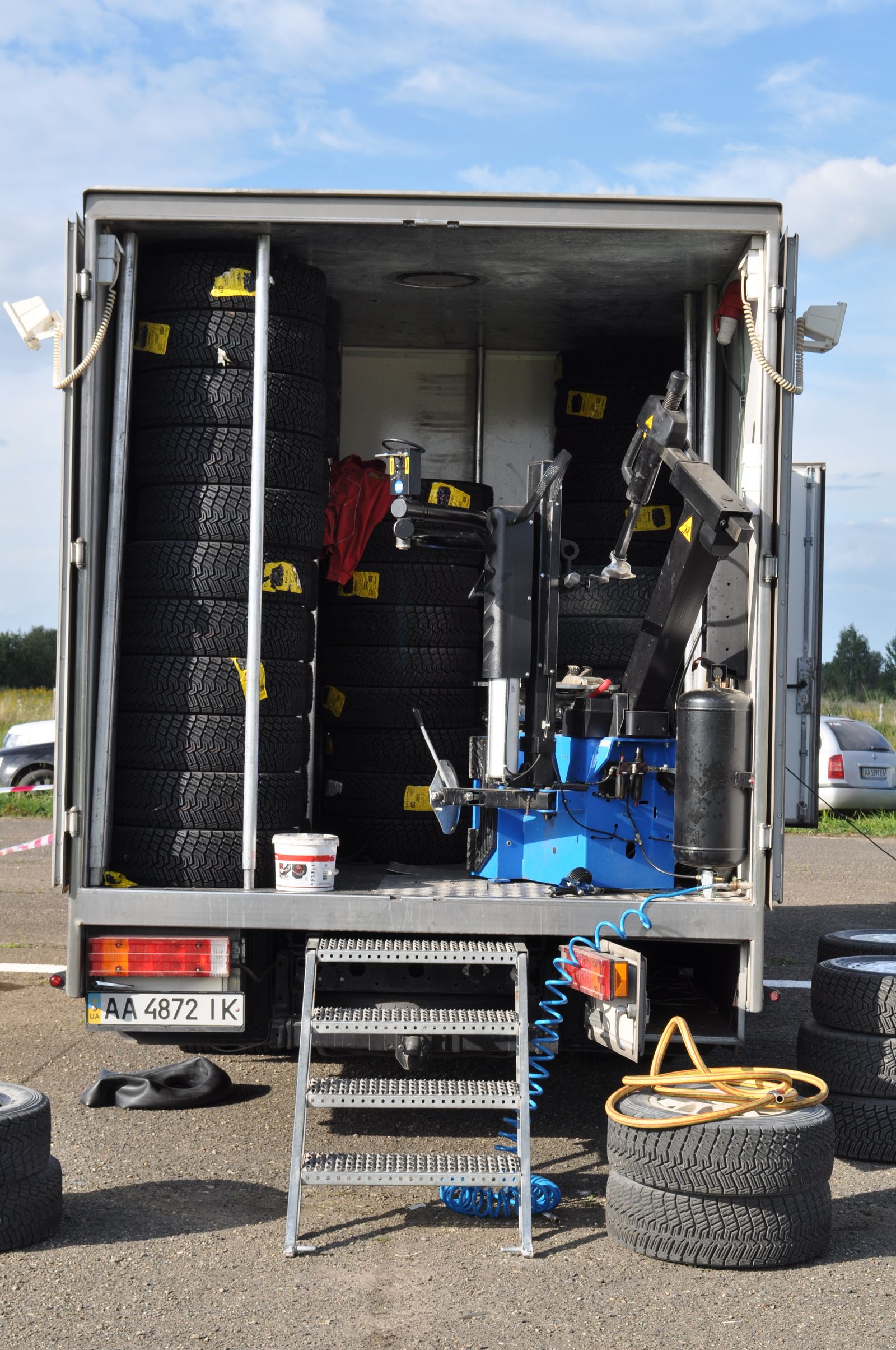 Tires and equipment stocked inside a mobile mechanic's service vehicle — illustrative stock photo, not a photo of Bats Mobile Mechanic or its truck.