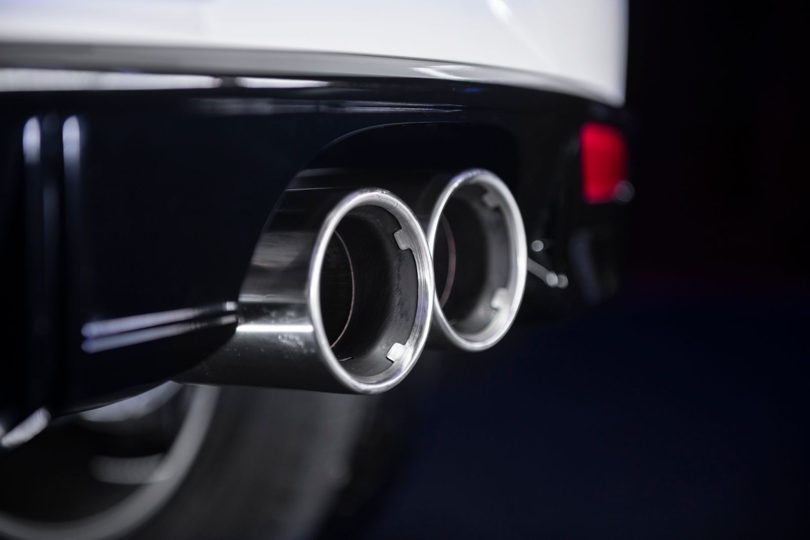 Close-up of dual chrome exhaust tips on a car — illustrative stock photo, not a photo of work done by Bryan Muffler & Performance.