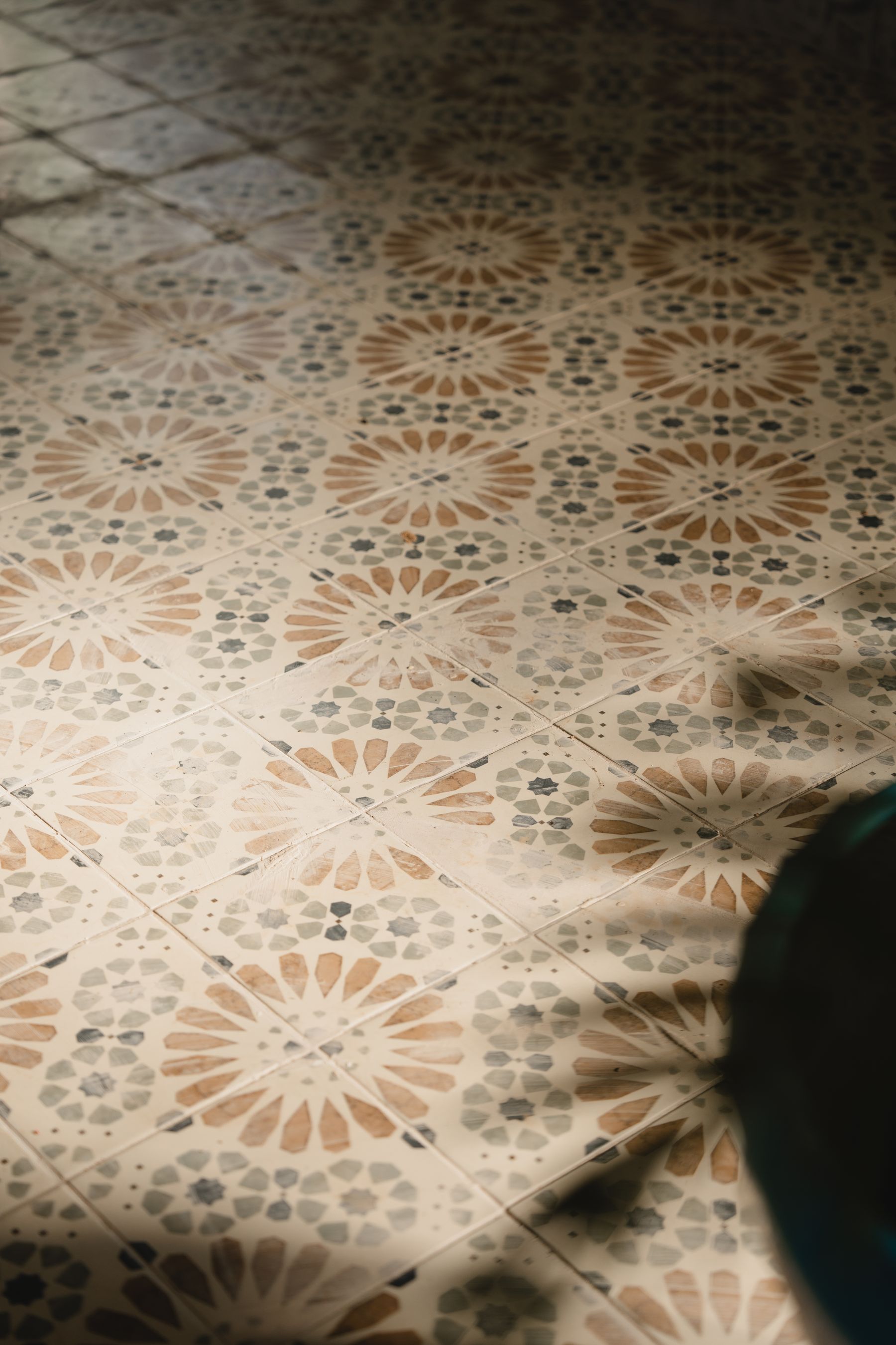 Warm patterned tile floor, illustrative stock photo