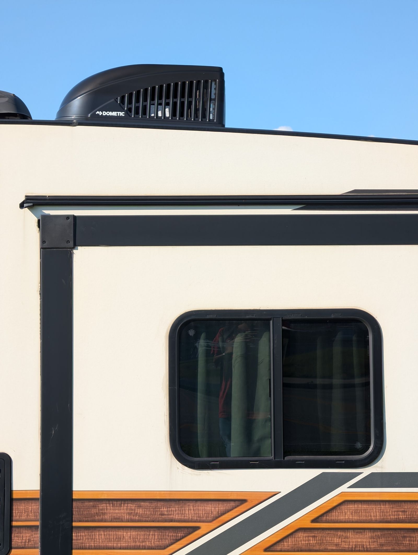 Illustrative close-up stock photo of an RV exterior — not a customer's actual RV.