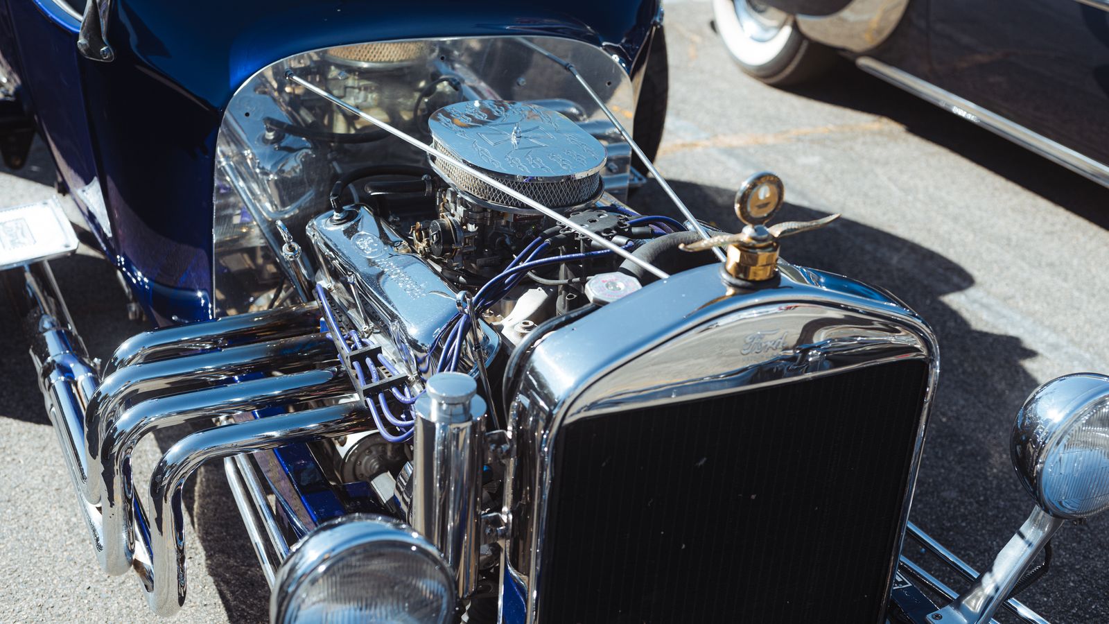 Illustrative close-up stock photo of a vintage car engine — not a customer's actual vehicle.